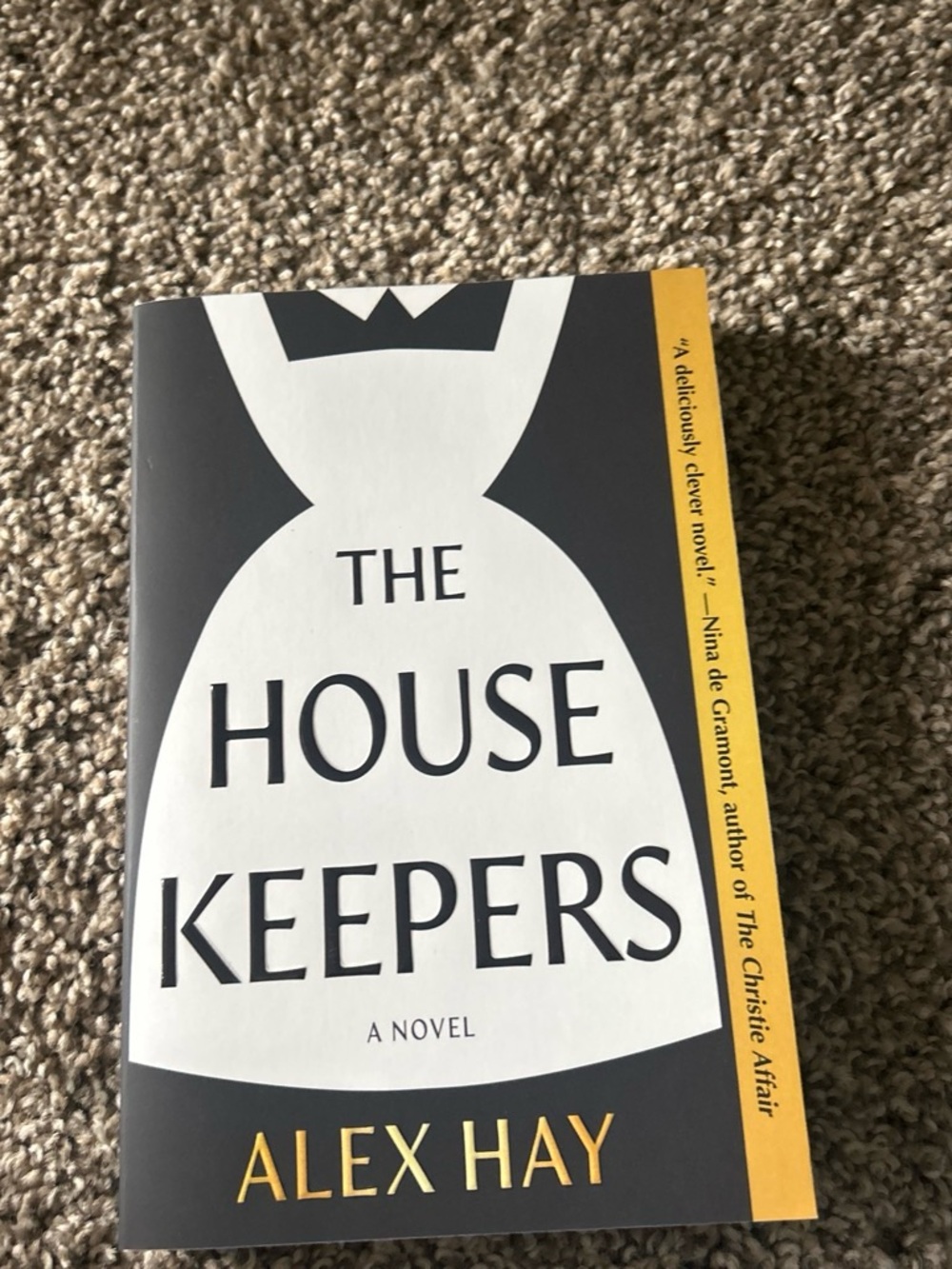The Housekeepers by Alex Hay - White & Black Cover with Yellow Accent